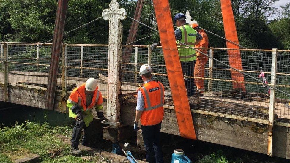 Lydney swing bridge is made ready to be lifted out of position ready for refurbishment