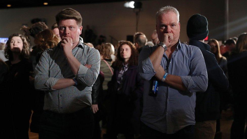 Biden supporters watch TV in Des Moines, Iowa