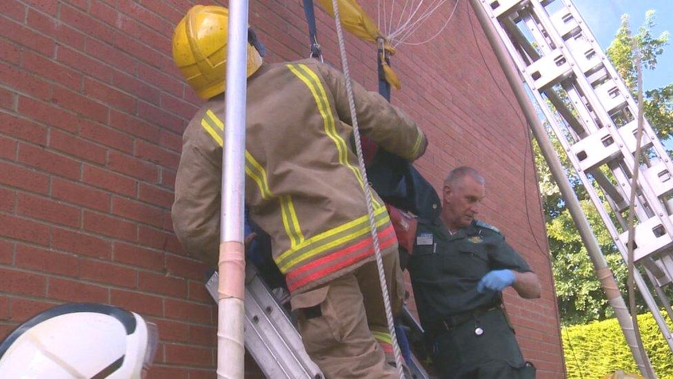 Emergency services rescuing Darren Crumpler