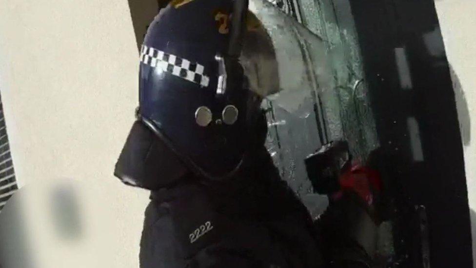 Police in raid with electric saw