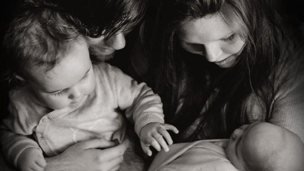 Danielle Randall with her family including Teddy (L)