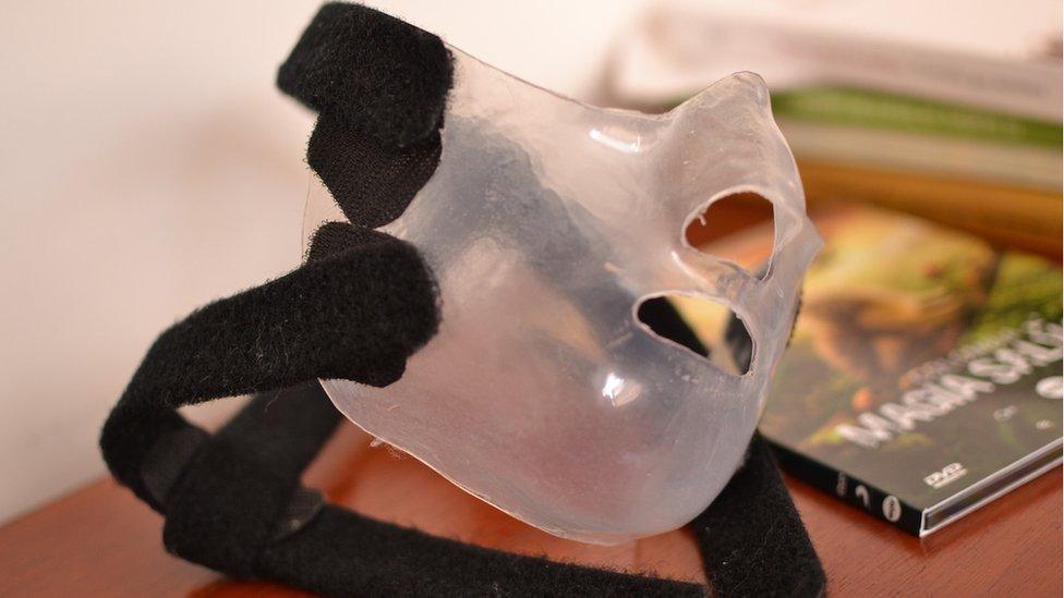 a transparent treatment mask with spaces for the nose and mouth