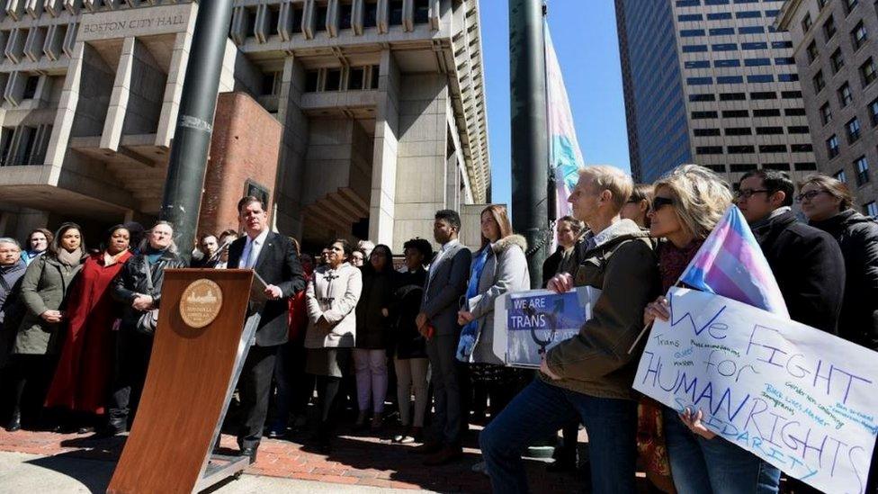 Mayor Walsh's addresses a crowd while raising the transgender flag above Boston's city hall