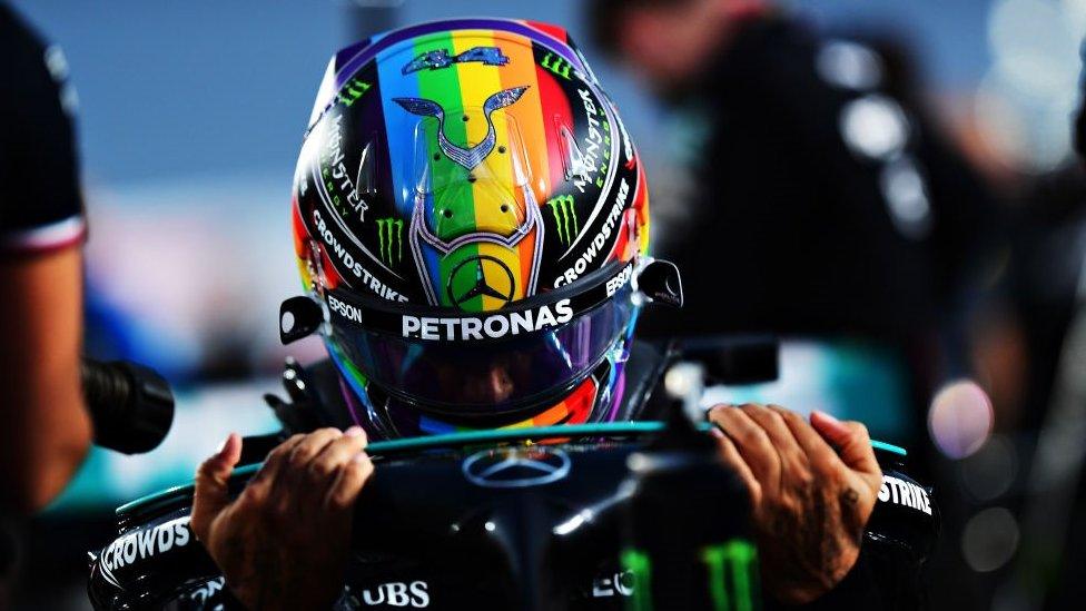 Lewis Hamilton wearing a pride flag helmet in Quatar