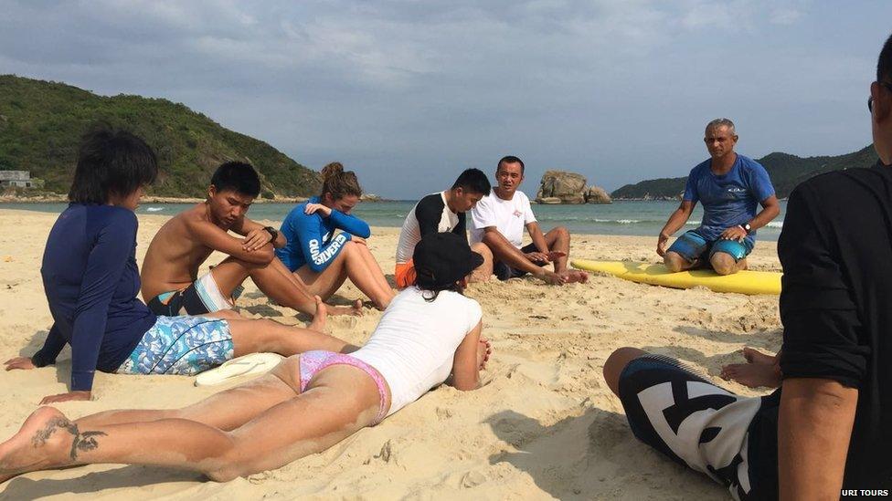 Italian coach Nik Zanella leads a surf group in China