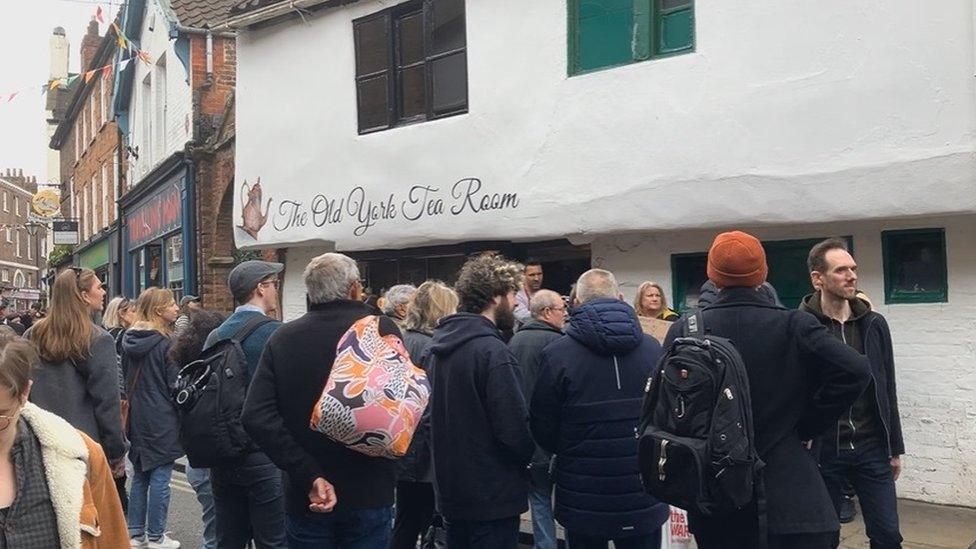 Crowd outside tea room