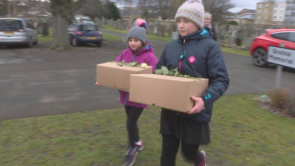 Children carrying remains