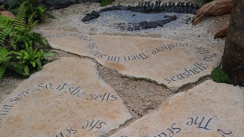 Stepping stones inscribed with the sea shells tongue twister