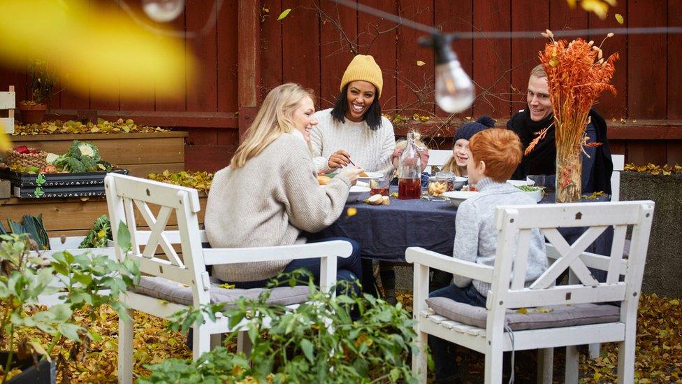 Group sitting at outdoor table