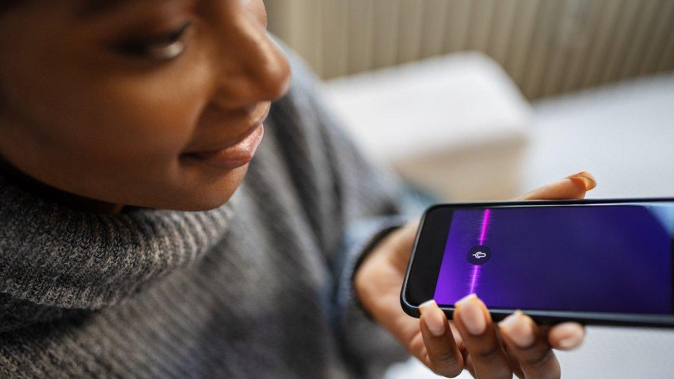 Woman talking to her smartphone