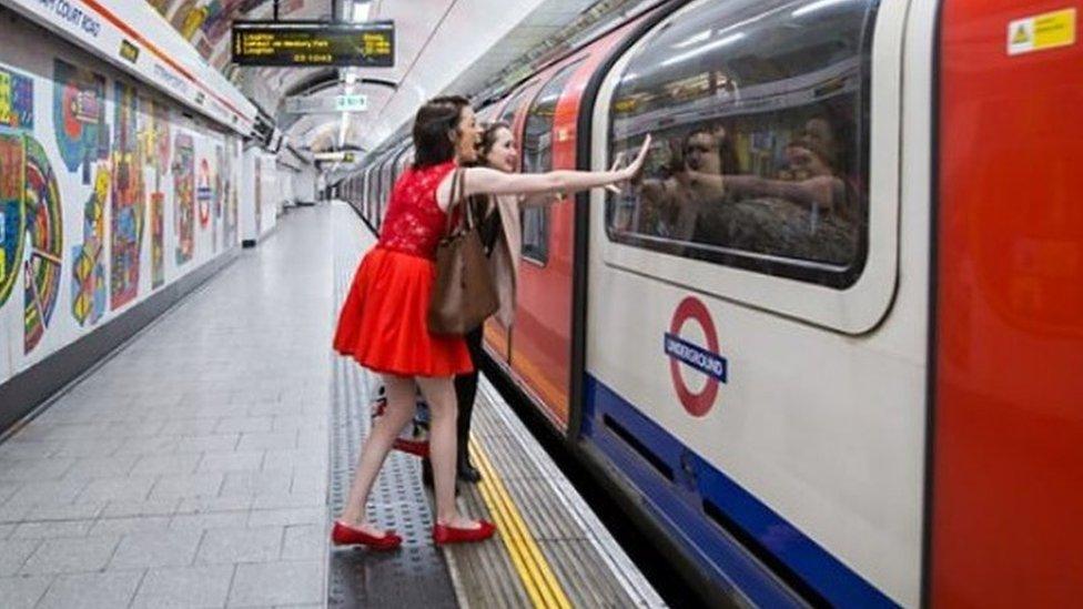 Revellers look happy as the night tube approaches