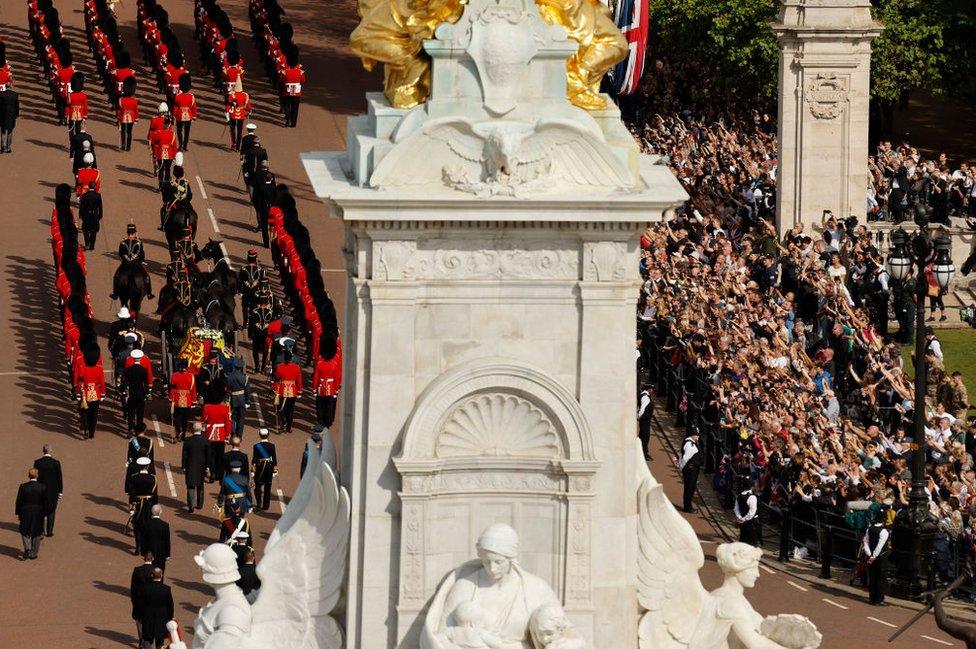 Crowds watching the procession taking the Queen's coffin to Westminster