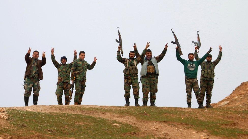 Syrian government forces celebrate taking control of village of Kiffin, on northern outskirts of Aleppo. 11 Feb 2016