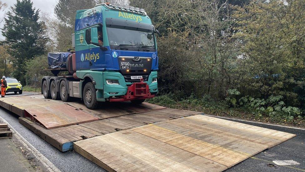 The abnormal load crossing a temporary bridge on Brockford Street