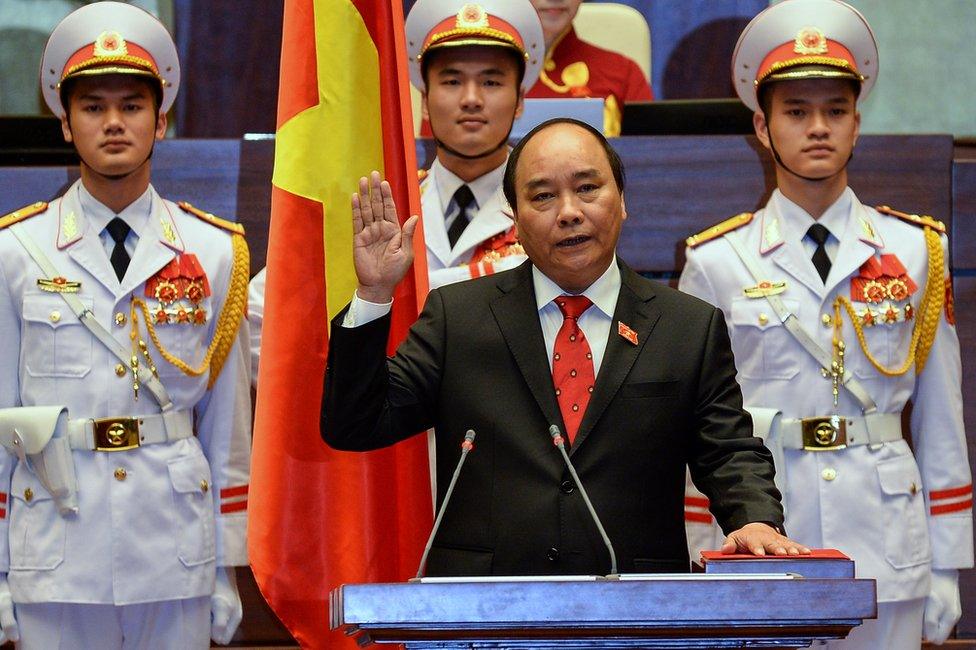 Newly elected Vietnamese Prime Minister Nguyen Xuan Phuc is sworn in during a ceremony at parliament house in Hanoi on 7 April 2016