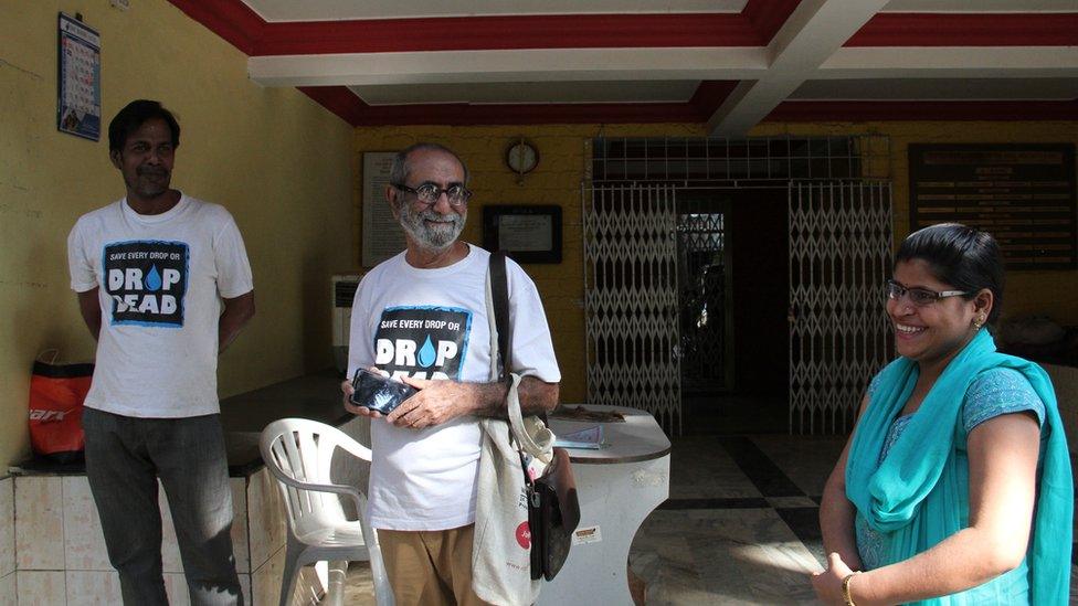 Mr Surti with the plumber and a resident of Mira Road