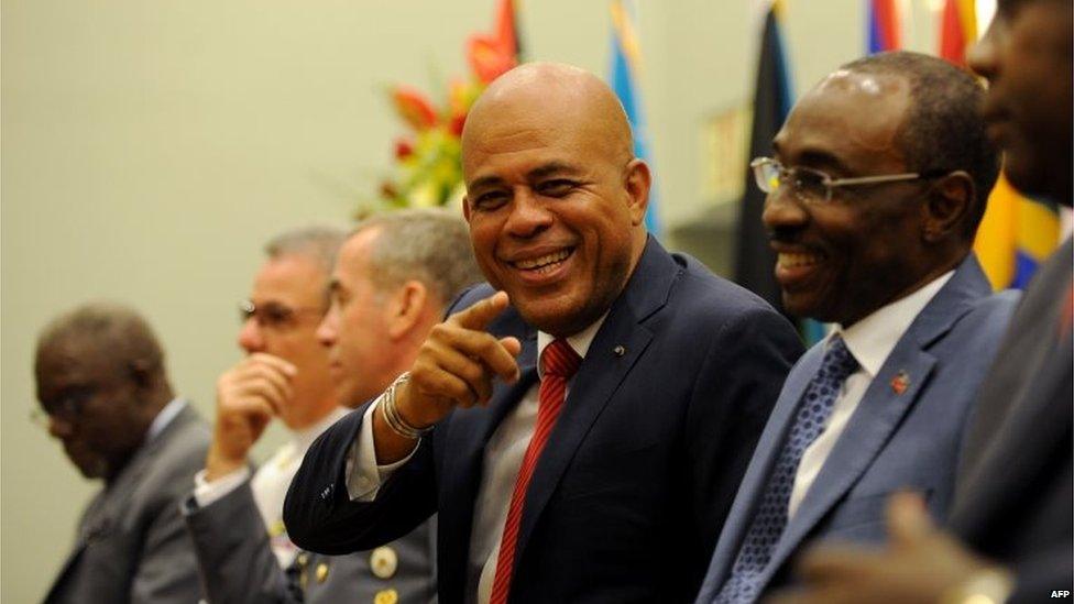 Michel Martelly smiles as he attends a ceremony in Petion Ville on 25 June, 2015.