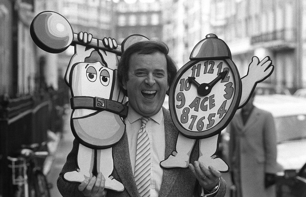 Terry Wogan poses with an alarm clock on in April 1984.