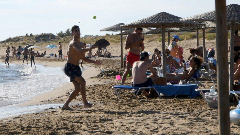 People on a beach in Corfu