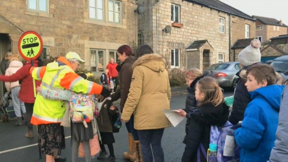 Mary's final road crossing with children from Summerbridge primary