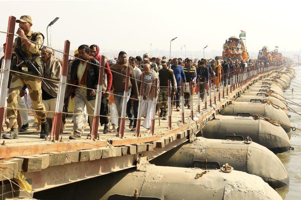 A procession of holy men and devotees at the Kumbh Mela.