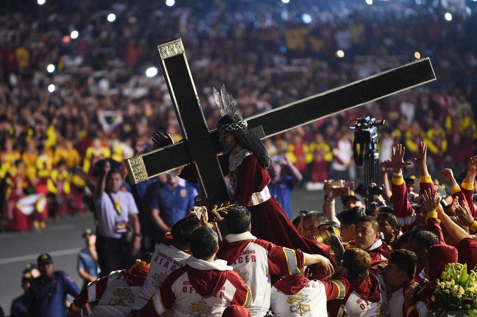 The Black Nazarene is carried into place by devotees in Manila (9 Jan 2019)