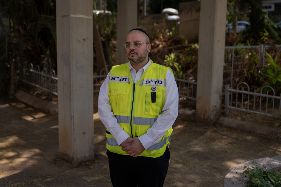 Yacoub Zechariah in his Zaka yellow vest. "Seeing an entire family killed breaks a person," he said.