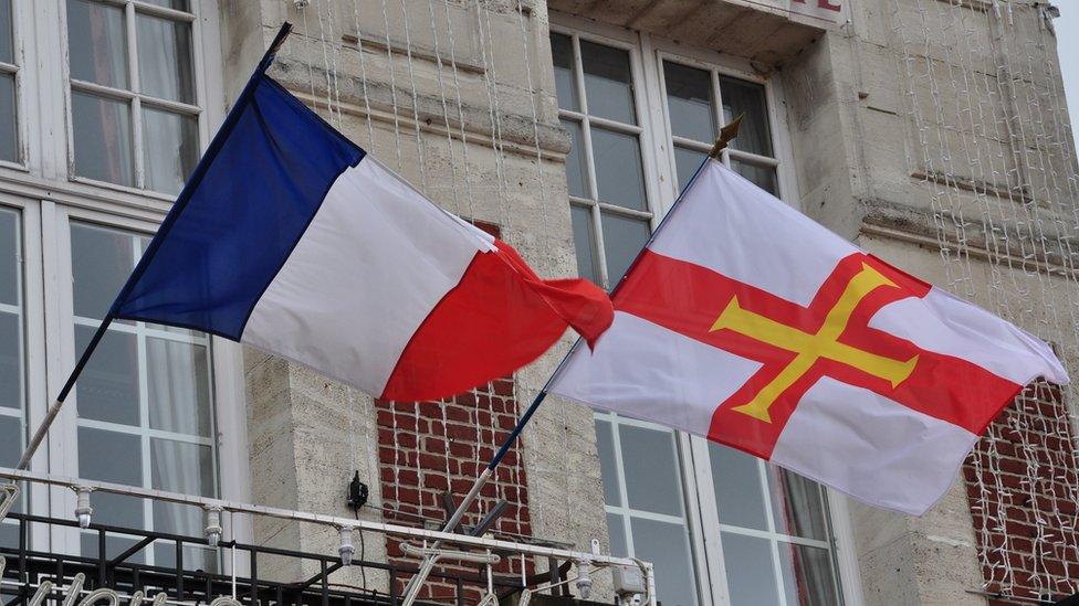 French and Guernsey flags flying from Masnieres town hall