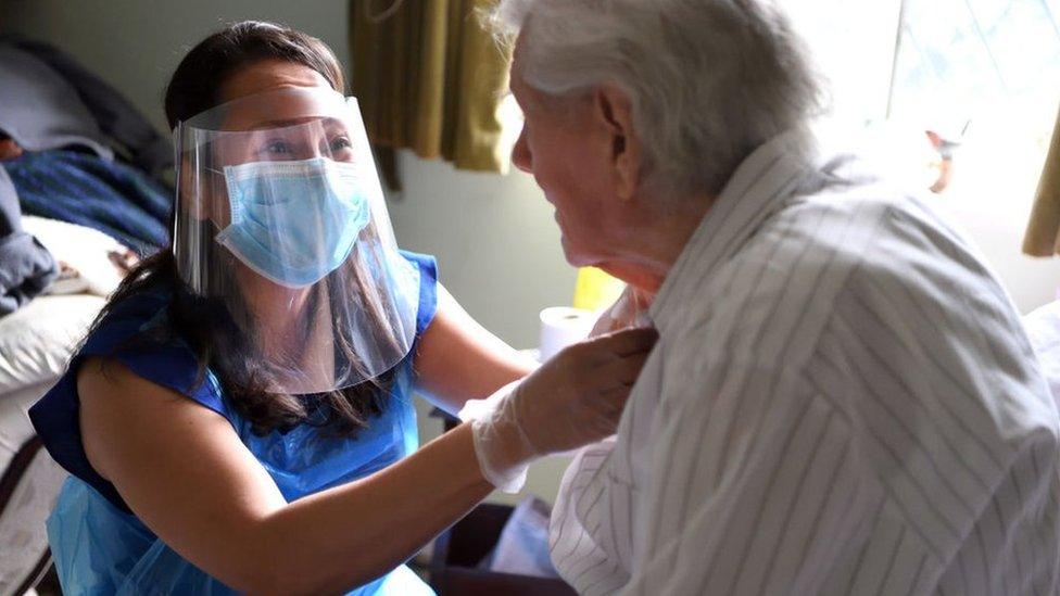 Picture of an elderly patient being looked after