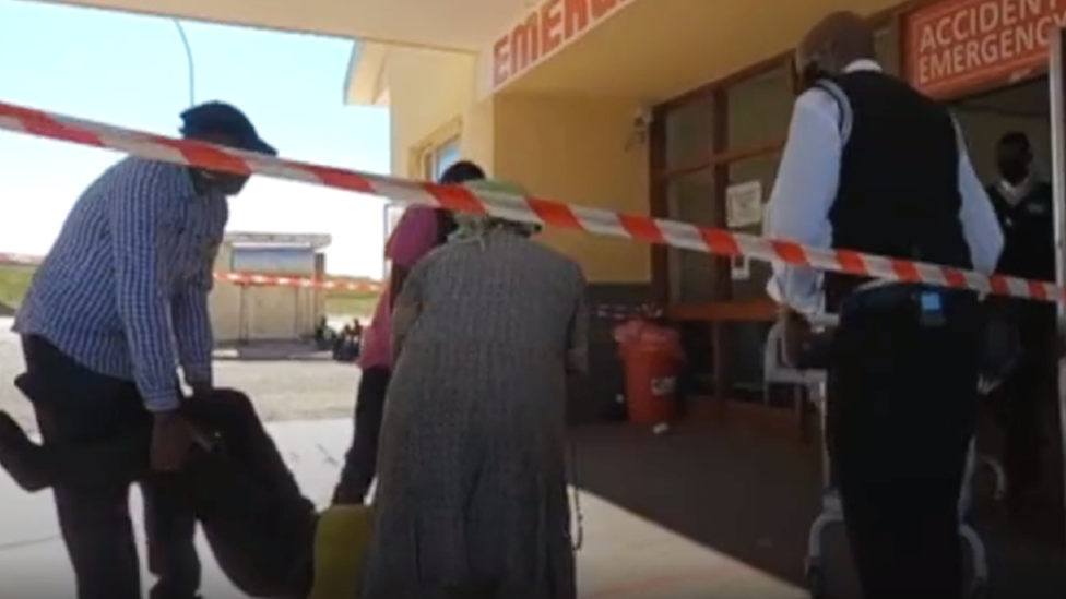 A patient being carried into an emergency entrance at Dora Nginza hospital in the Eastern Cape, South Africa