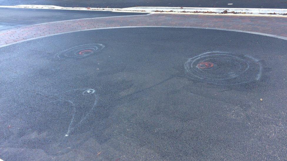 ghostly eyes and mouth on Tenison road roundabout