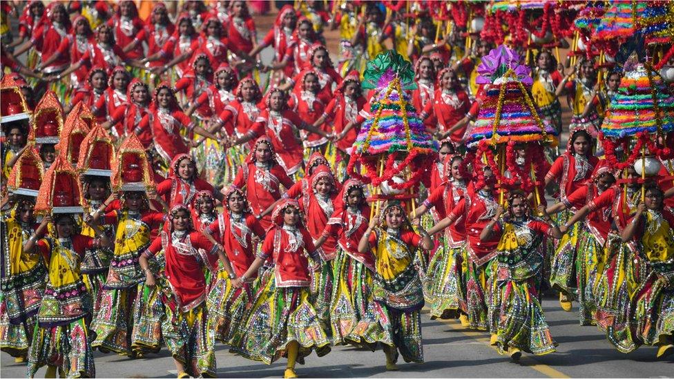 Schoolchildren dance on Rajpath during the Republic Day parade in New Delhi on January 26, 2020.