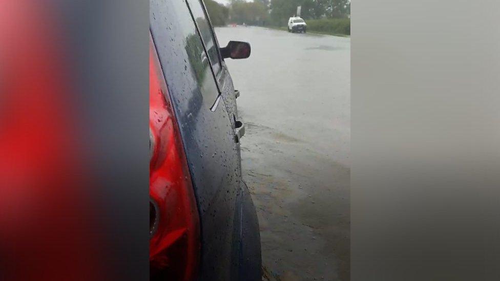 Car stuck in flood water