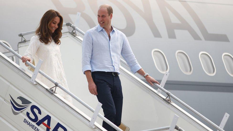 Duke and Duchess of Cambridge walk down the steps of a plane as they arrive in Lahore on 17 October 2019