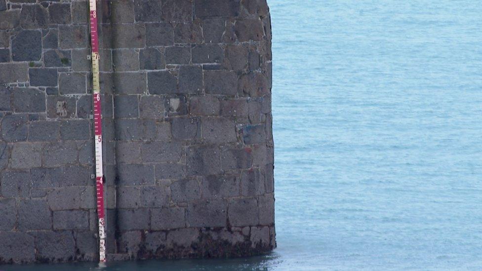 Paint on the harbour wall