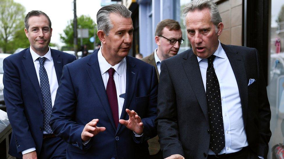 Edwin Poots (red tie) talks to MP Ian Paisley outside DUP headquarters on Friday