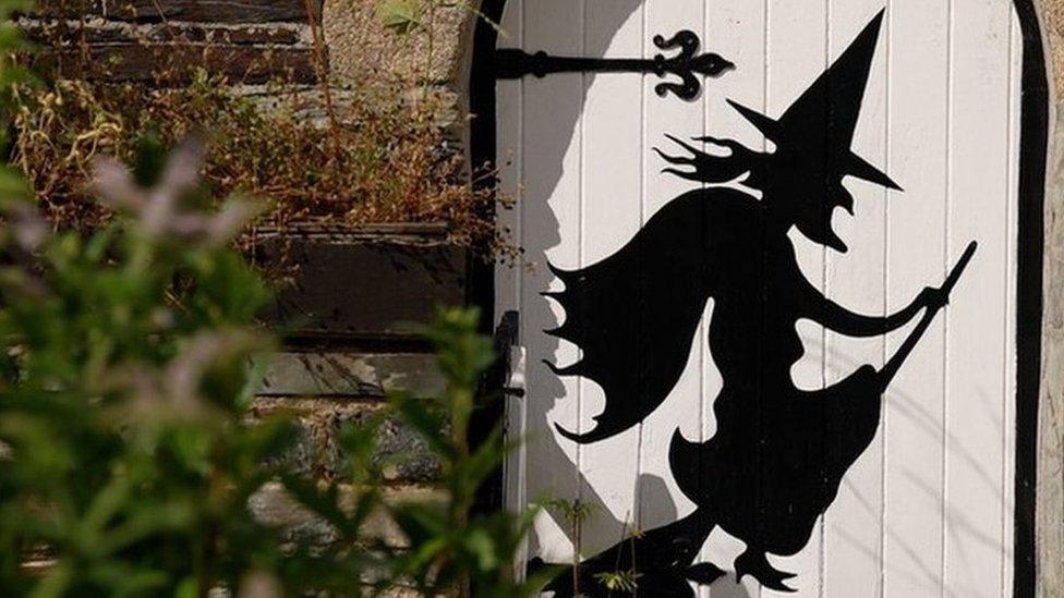 Witch image on a door