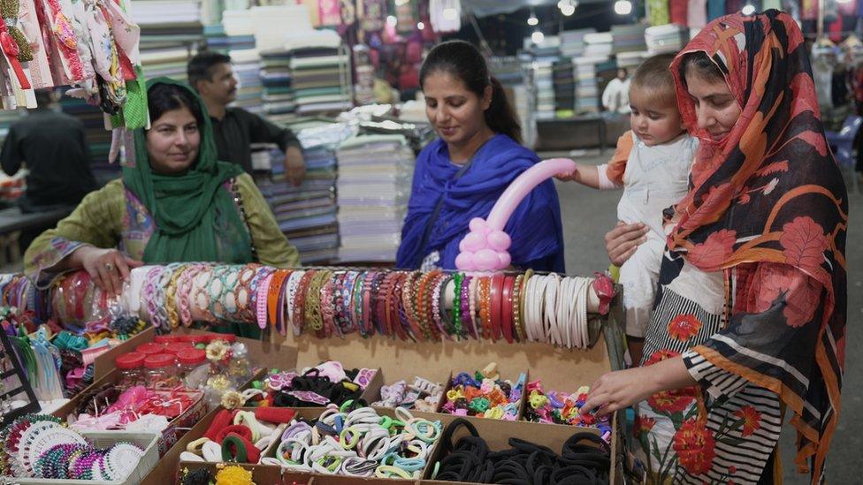 Iram and Noreen shop in an Islamabad market