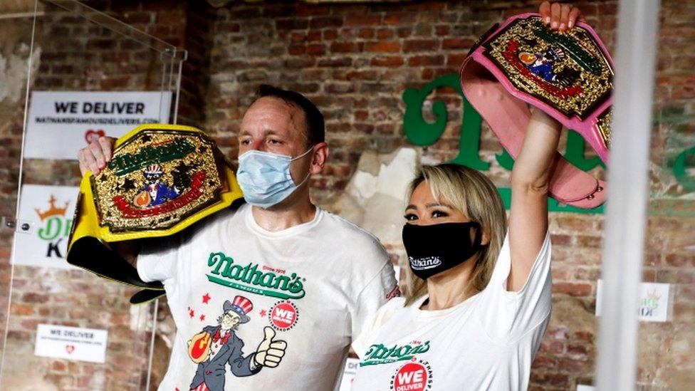 Champions of the 104th annual Nathan's Hot Dog Eating Contest, Joey Chestnut and Miki Sudo