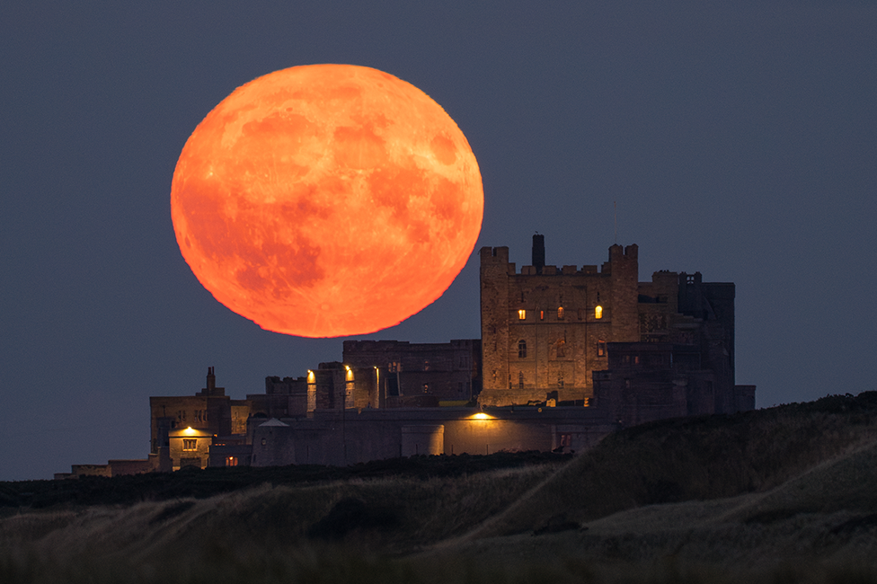 Moon over Bamburgh Castle