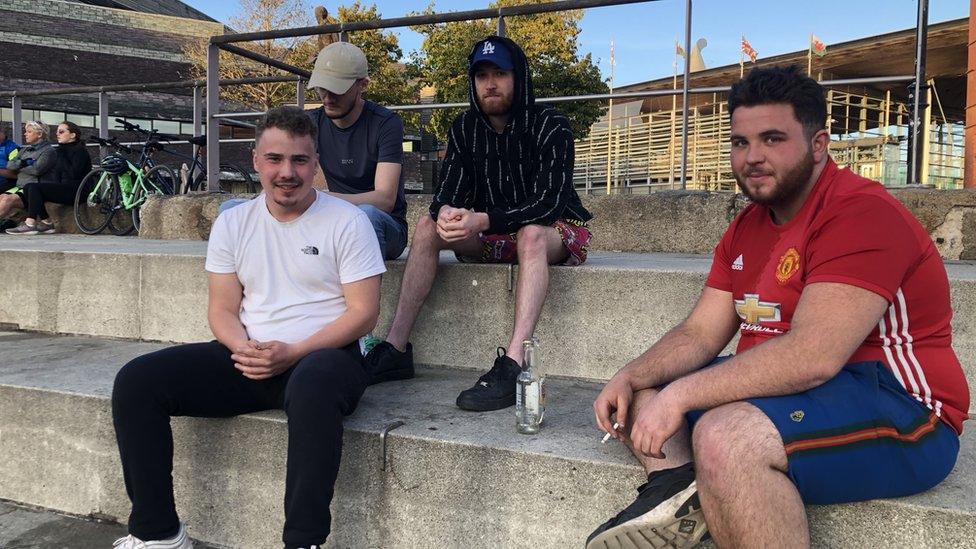 A group of young men drinking at Cardiff Bay