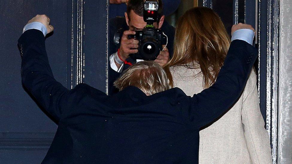 Prime Minister Boris Johnson reacts as he arrives at the Conservative Party's headquarters in London, 13 December 2019