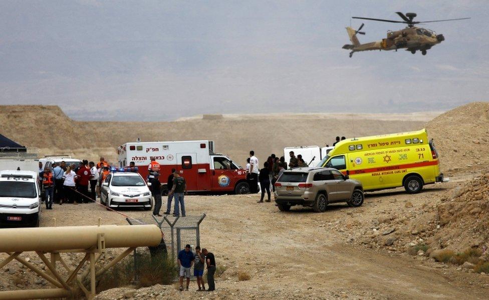 Israeli emergency services take part in a search for a missing student near Arava in southern Israel