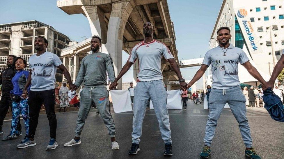 People take part in an exercise on a street in Addis Ababa, 3 February