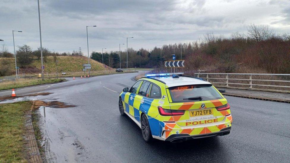 A police car at the junction 44 roundabout