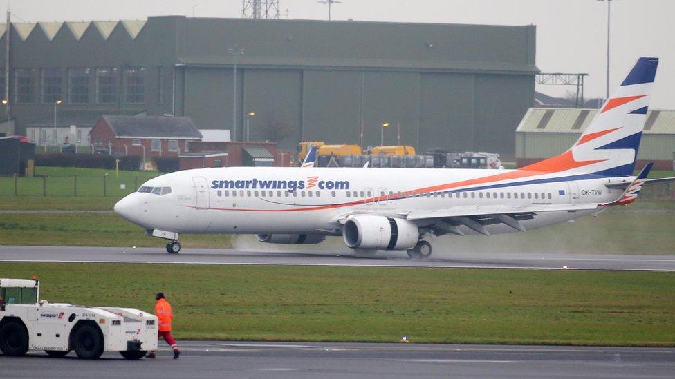 A flight carrying the 51 refugees landed at Belfast International Airport on Tuesday