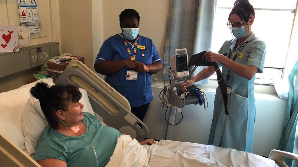 Emily Burrows with staff in hospital