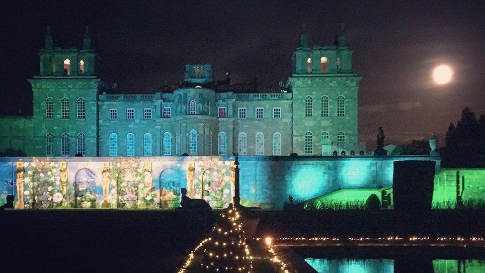 An image of Blenheim Palace with the supermoon beside it