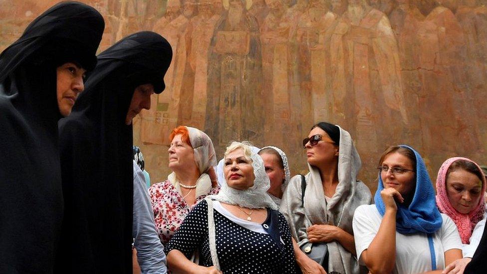 Believers of the Ukrainian Orthodox Church (Moscow Patriarchate) take part in a religious procession in Kiev on 27 July 2018