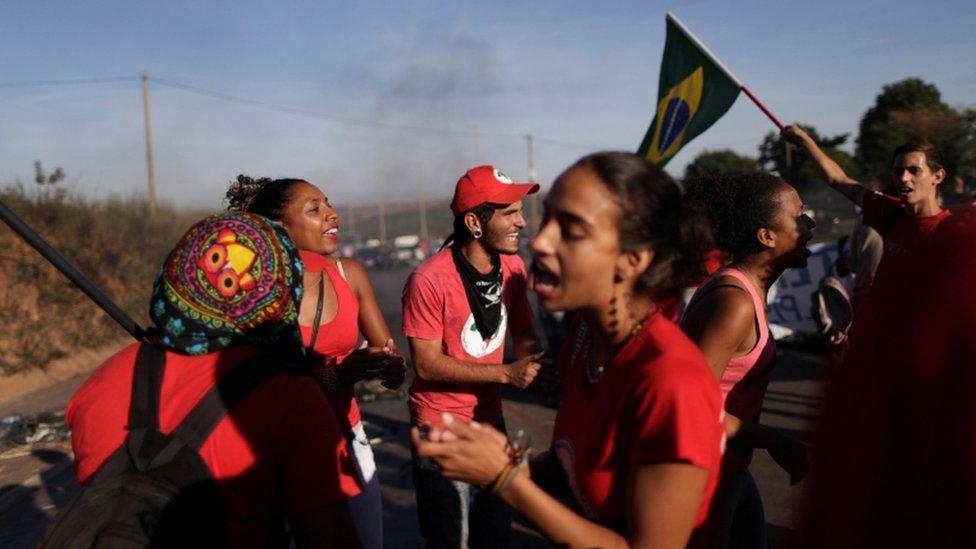 Members of the Landless Workers Movement (MST) take part in a protest against the impeachment